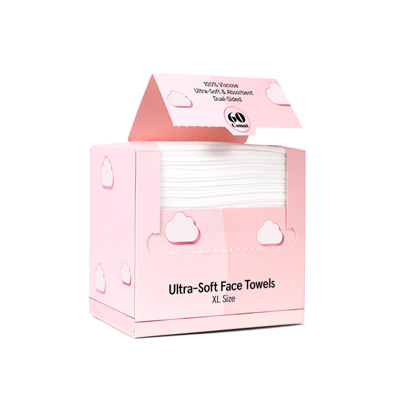 A pack of 60 extra-large disposable face towels in a travel-friendly box for clean skincare.